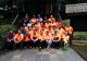 Employees hike uphill to help church