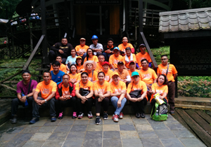 Employees hike uphill to help church